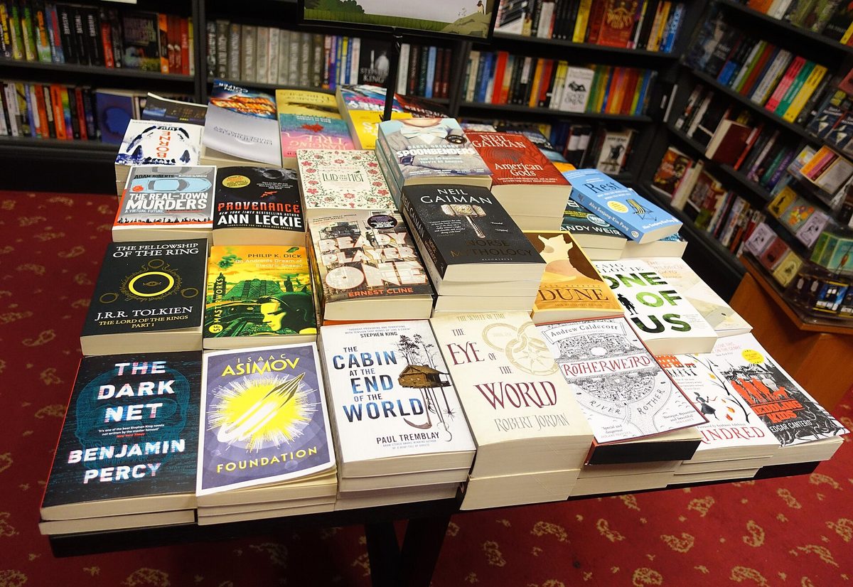 A table of new paperback fiction in a bookshop