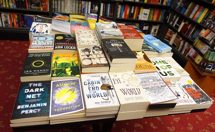 A table of new paperback fiction in a bookshop