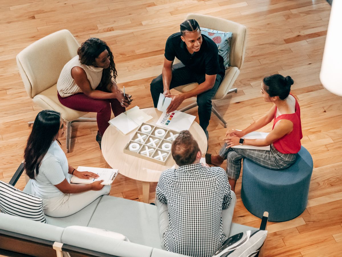 People at the office lobby having a discussion