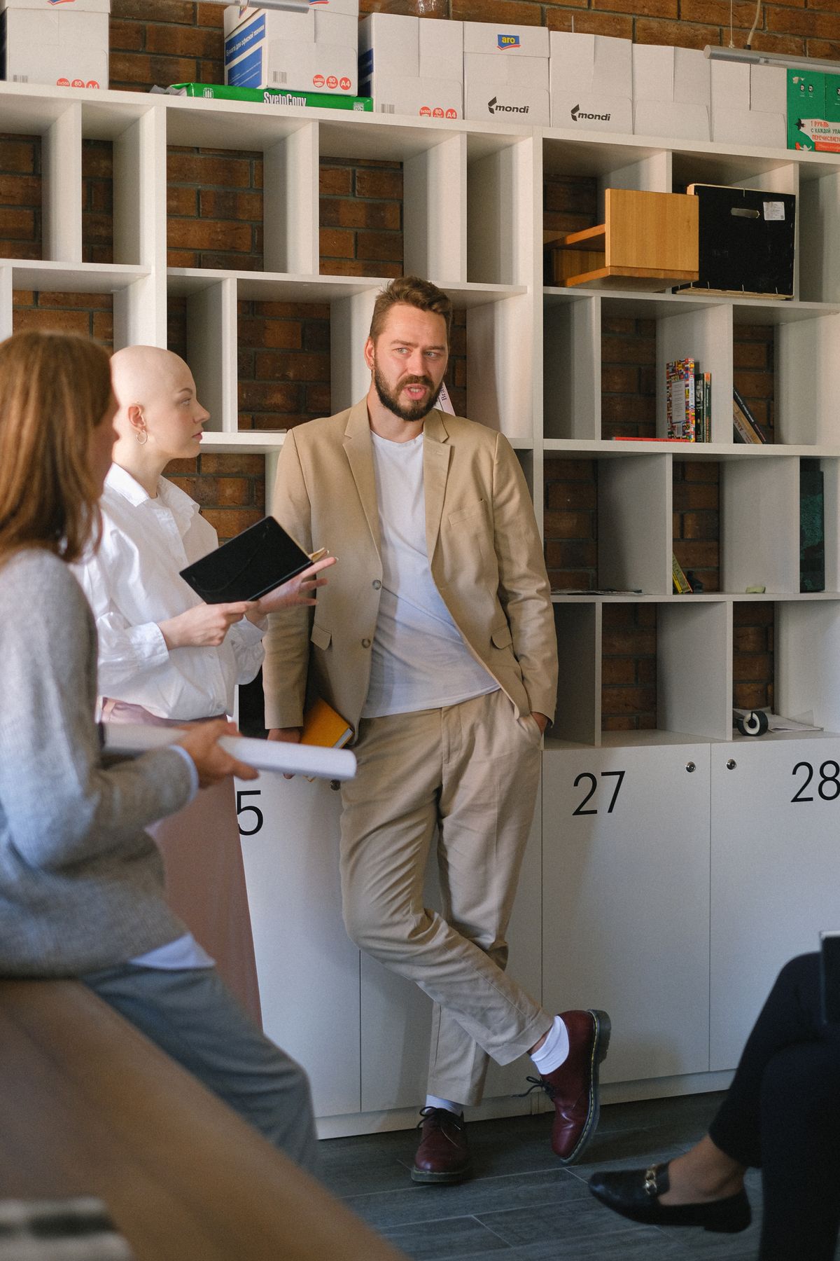 Colleagues discussing business strategy in office