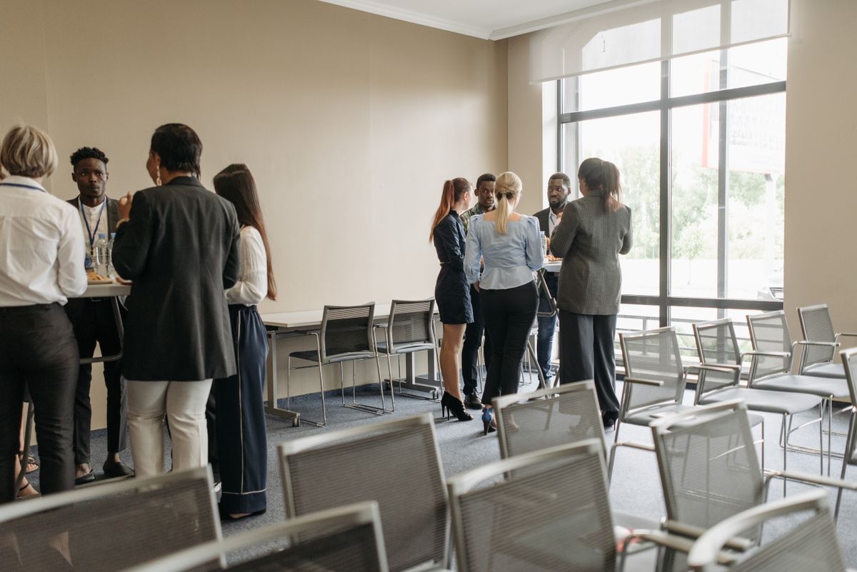 Groups of people talking in the office