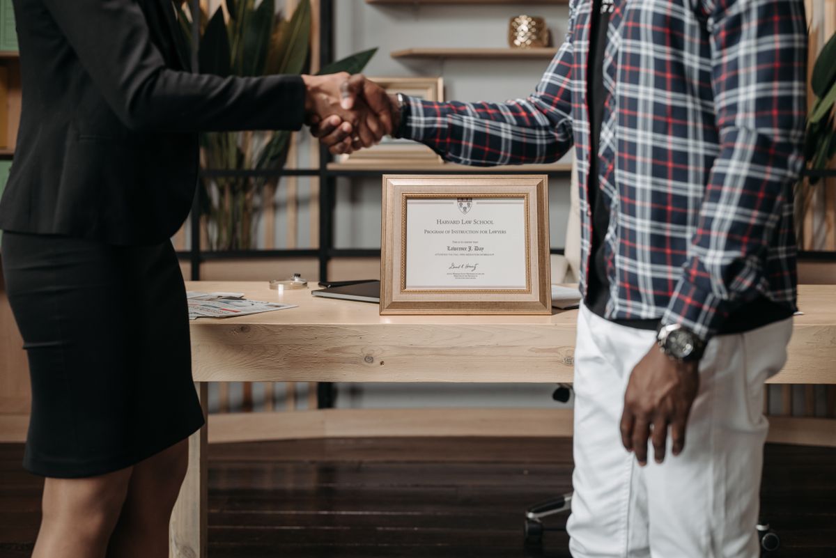 A lawyer and a client shaking hands