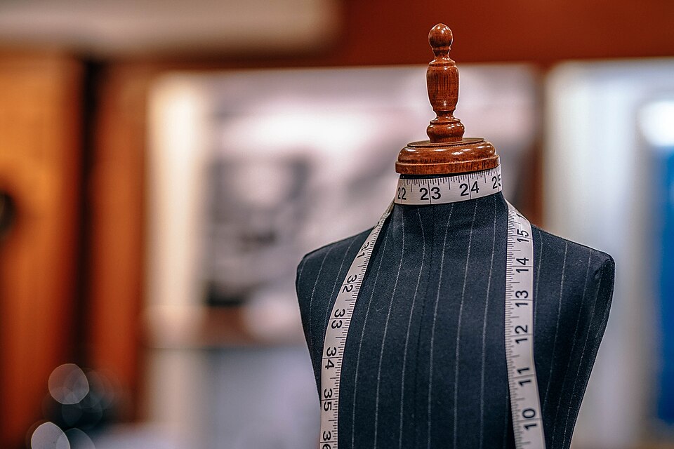 A tailor's mannequin with a measuring tape